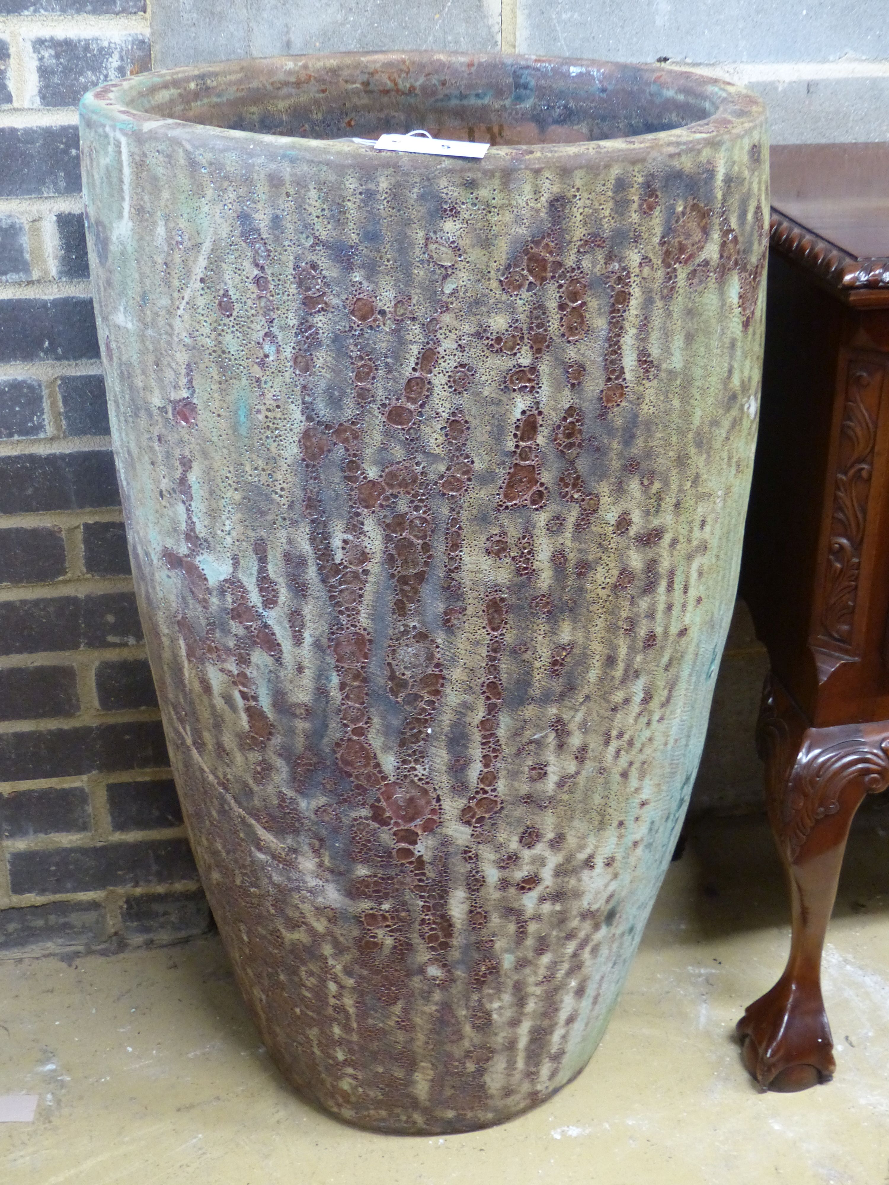 A tall glazed Earthenware garden planter, diameter 54cm height 94cm